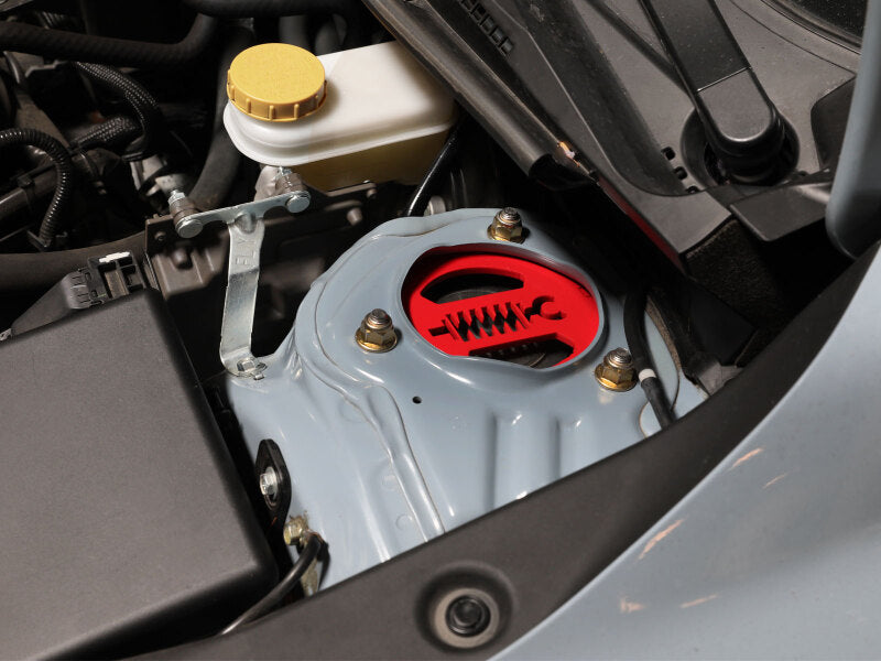 aFe 18-23 Subaru Crosstrek CONTROL 1.5in Lift Kit showing the lift kit component installed in the engine bay.