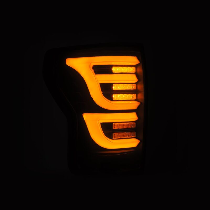 AlphaRex LUXX-Series LED tail light for 07-13 Toyota Tundra in black, featuring bright amber LED accents.