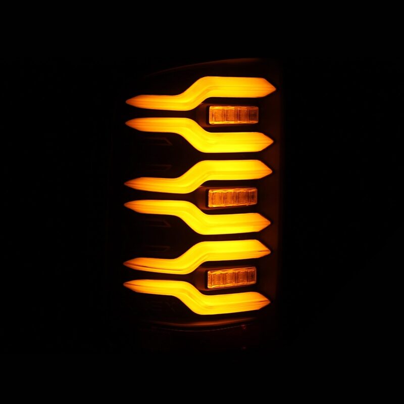 AlphaRex LUXX-Series LED tail lights for 14-18 GMC Sierra, featuring a sleek black design with sequential signal lights.