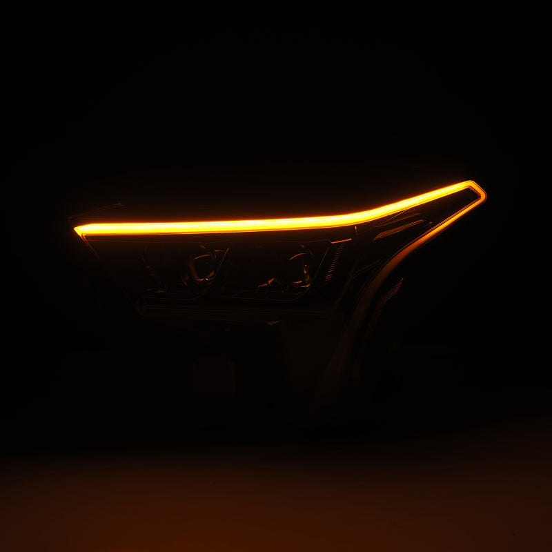 AlphaRex LUXX-Series headlights for 22-23 Toyota Tundra in alpha-black with amber daytime running lights.