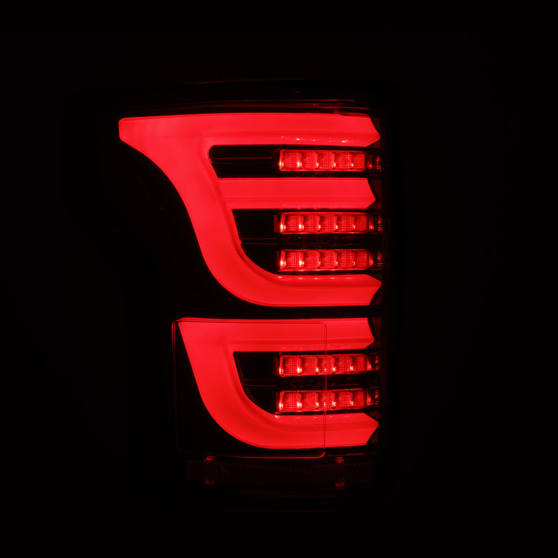 AlphaRex Luxx-Series LED tail lights for 2015-2020 Ford F150 in alpha-black finish, featuring a sleek red illumination design.