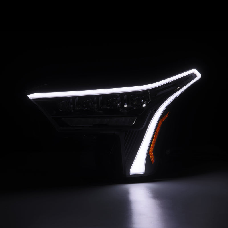 AlphaRex NOVA-Series black headlights for 2022-2023 Toyota Tundra featuring white daytime running lights.