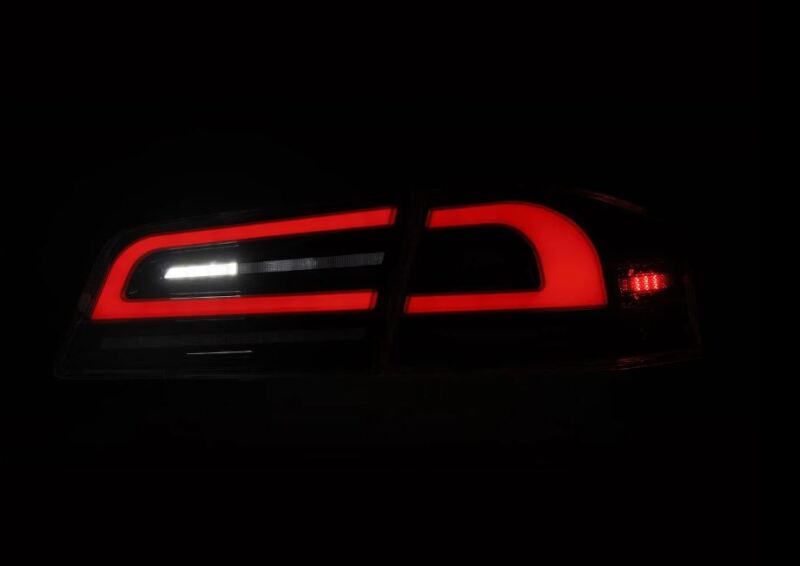 AlphaRex LUXX-Series LED tail lights for 12-21 Tesla Model S in Alpha-Black, featuring a sleek design and bright illumination.