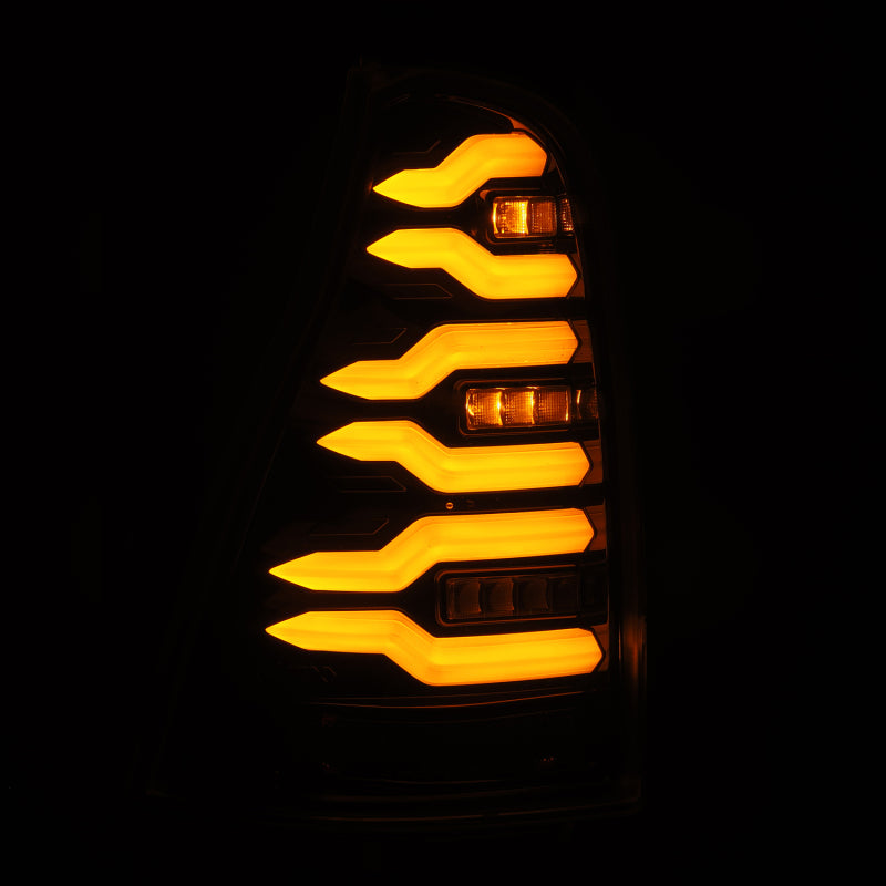AlphaRex LUXX-Series LED tail lights for 2003-2009 Toyota 4Runner in black, showcasing bright amber illumination.