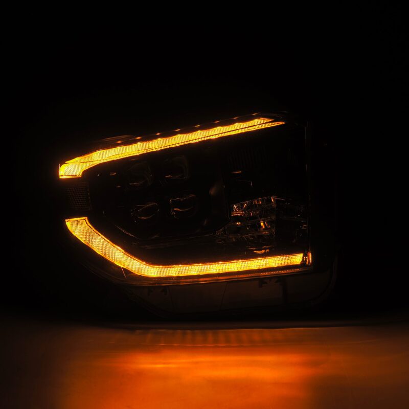 AlphaRex NOVA-Series LED projector headlights for 14-21 Toyota Tundra in black with active lighting and sequential signals.