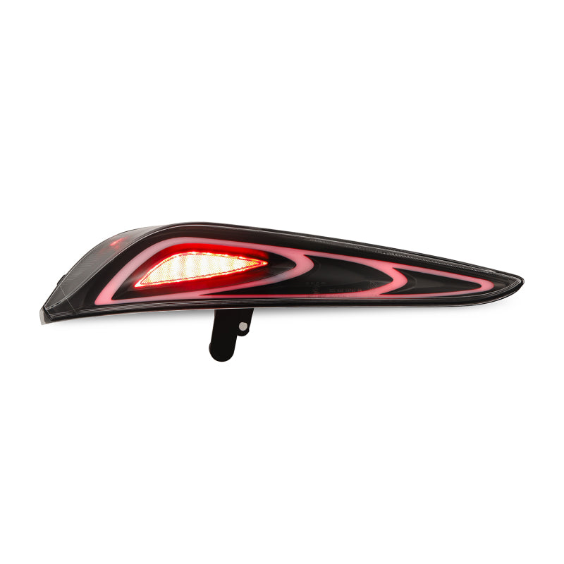 AlphaRex LUXX-Series FT-1 Style LED tail light for 20-24 Toyota Supra in black, featuring a sleek design and bright illumination.