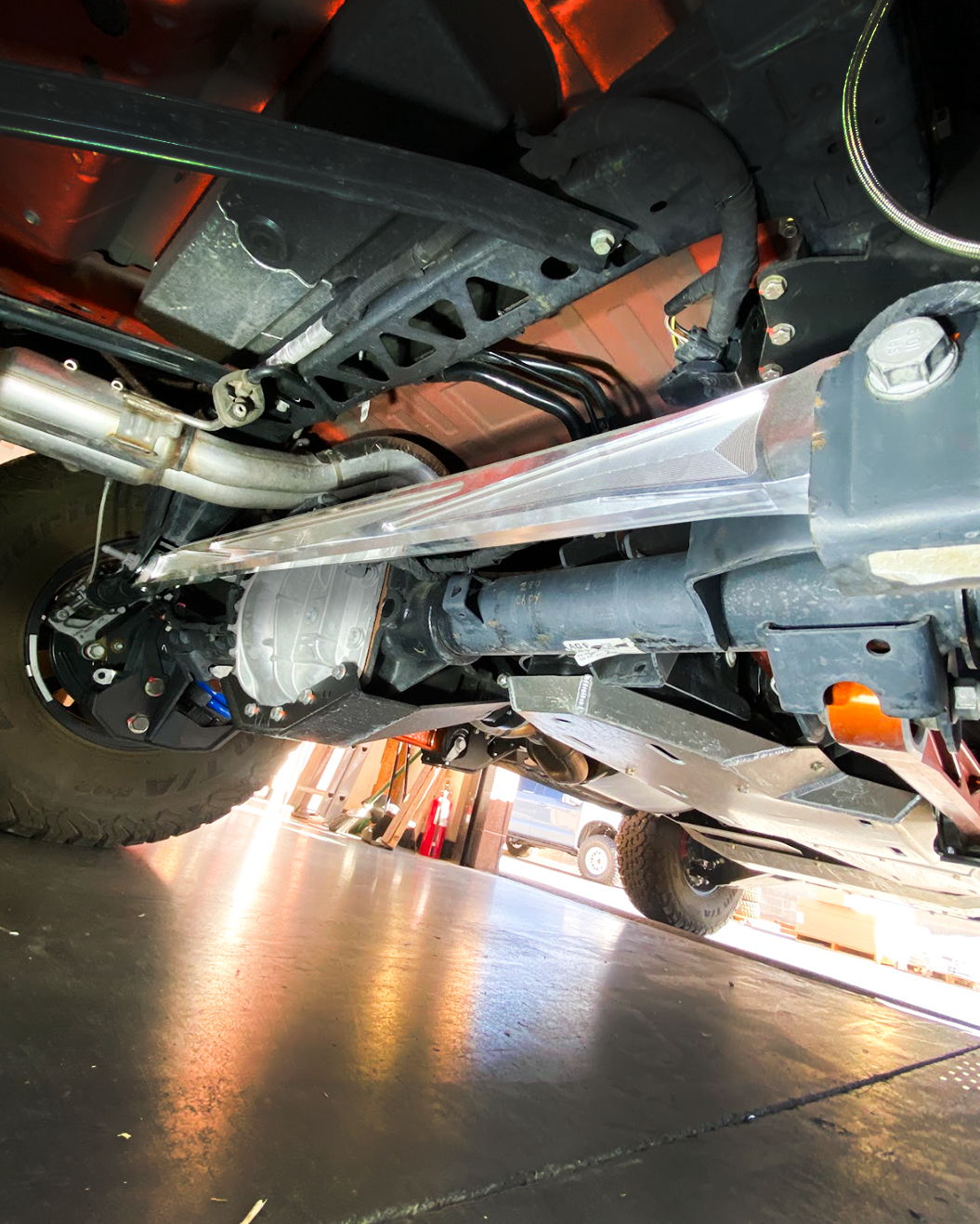 2022+ Bronco Raptor billet panhard bar featuring an ultra-flex joint, installed under the vehicle for enhanced performance.