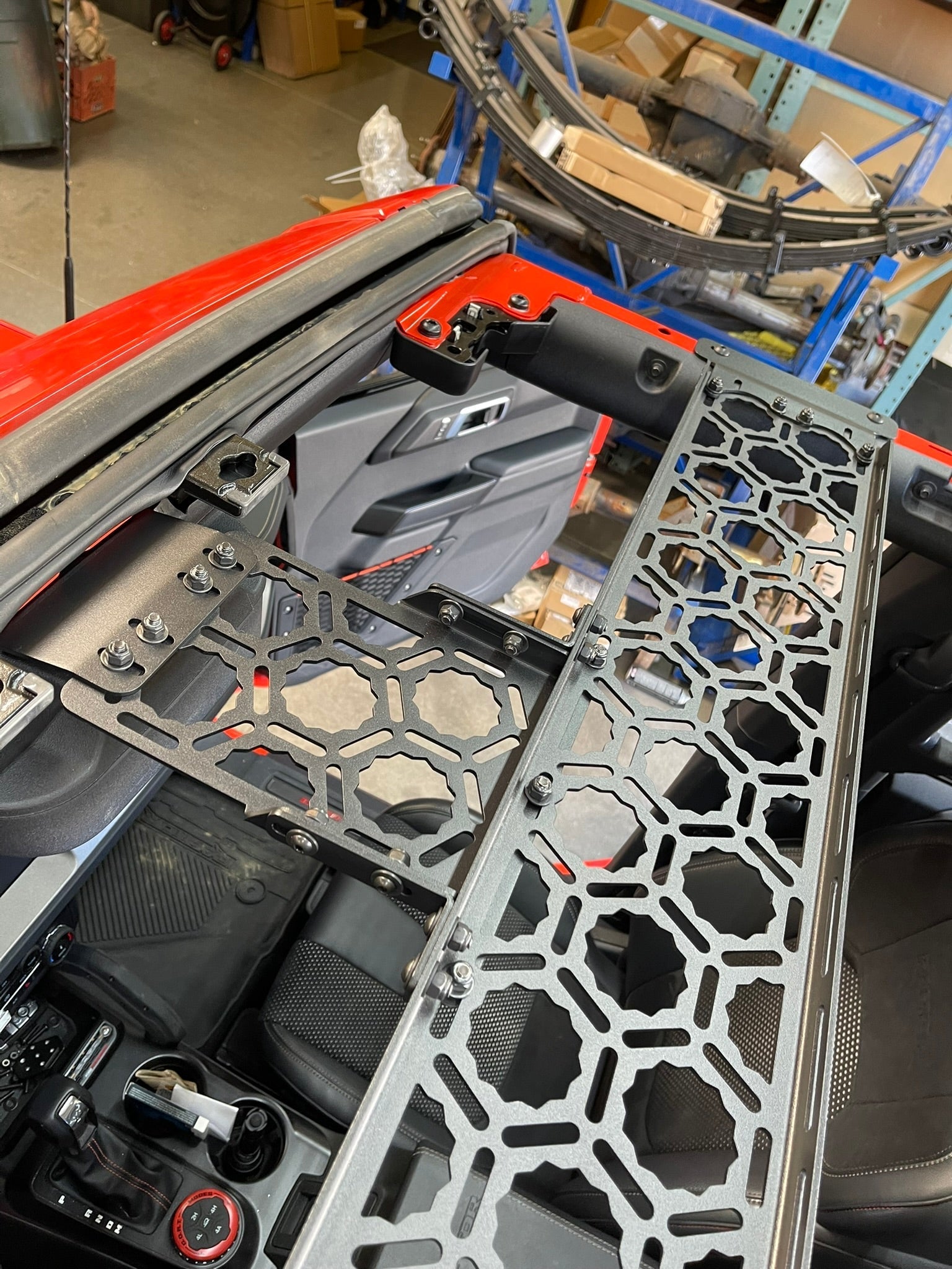 Inside view of a 2022 Bronco Raptor showing the Adapt-A-Panel short front roof mount installation with a sleek design.