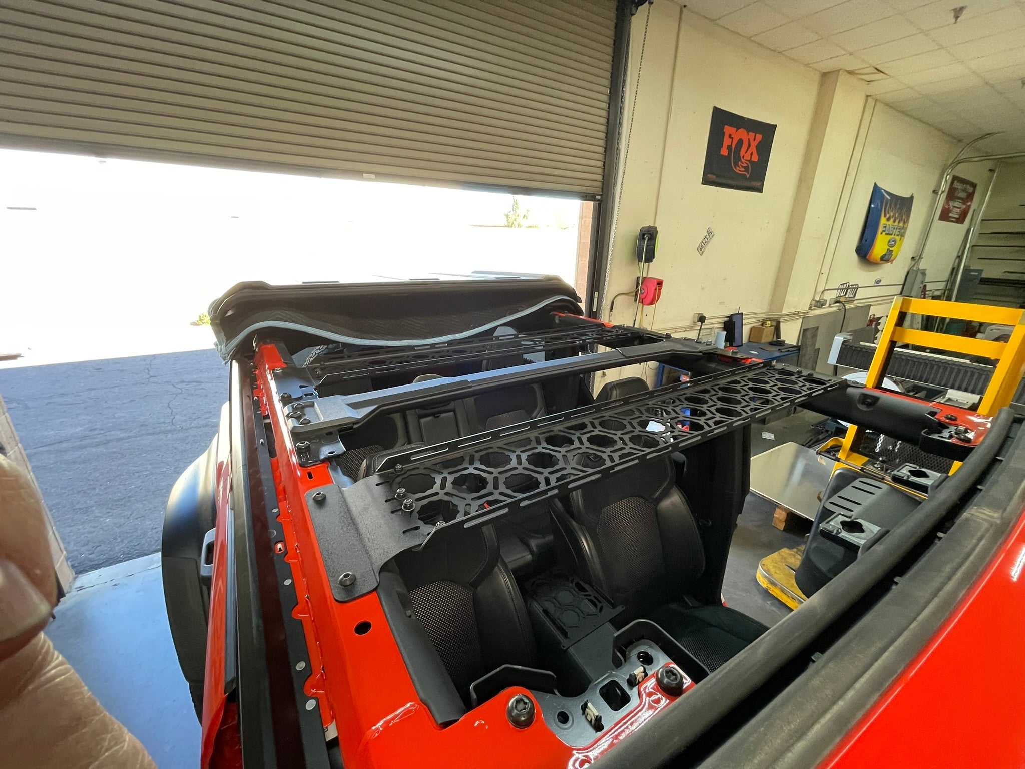 2021 Bronco inside roof panel mount by Adapt-A-Panel, showcasing installation in a workshop setting.