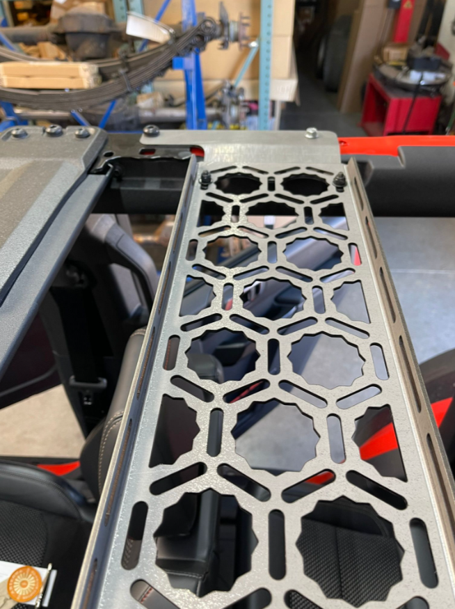 Inside roof panel mount for 2021 Bronco, designed by Adapt-A-Panel, showcasing a durable metal structure for storage.