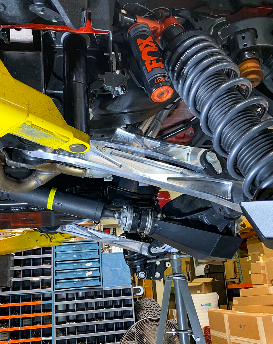 Billet aluminum rear suspension arms with ultra-flex joints installed on a 2022 Bronco Raptor, showcasing offroad performance components.