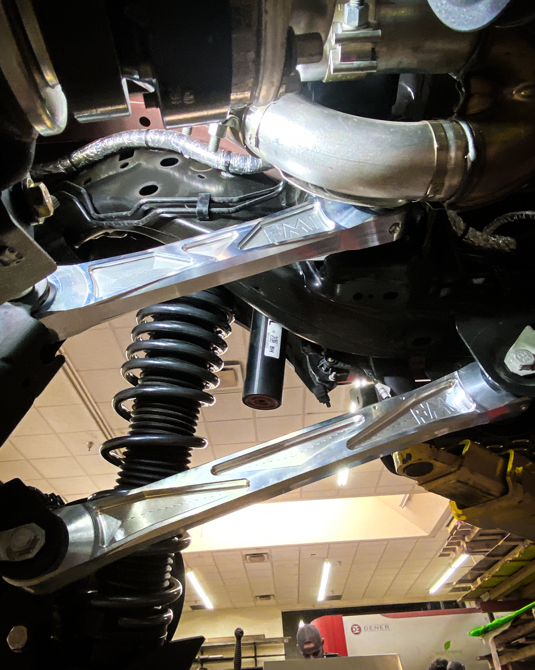Billet aluminum rear suspension arms with ultra-flex joints installed on a 2022 Bronco Raptor, showcasing durability and performance.