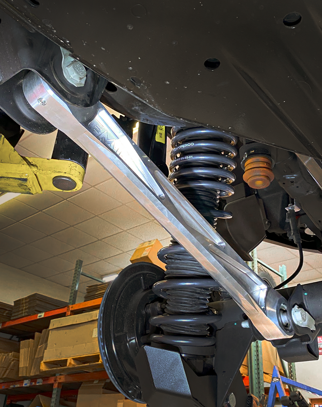 Billet aluminum rear lower suspension arms with ultra-flex joints installed on a 2022 Bronco Raptor, showcasing enhanced offroad performance.