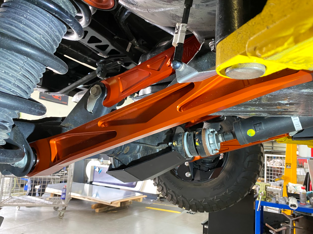 Billet aluminum rear lower suspension arms with ultra-flex joints installed on a 2022 Bronco Raptor, showcasing durability and performance.