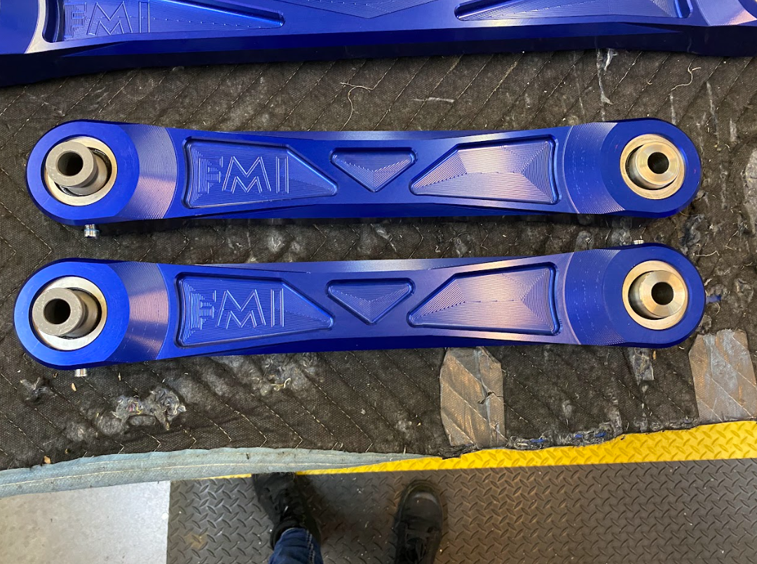 Billet aluminum rear upper suspension arms for 2022 Bronco Raptor featuring ultra-flex joints in blue finish.