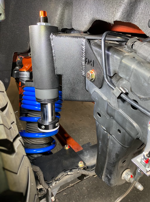 Rear hydraulic bump stop kit for 2022+ Bronco Raptor, showcasing installation details and suspension components.