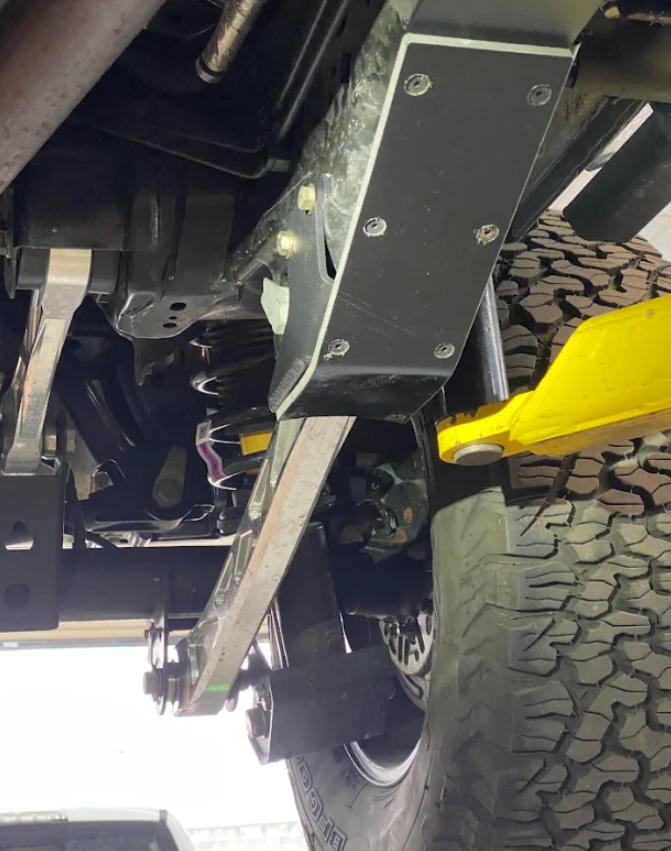 2022+ Bronco Raptor rear lower arm frame guard featuring HDPE slide, showcasing durable protection and off-road capability.