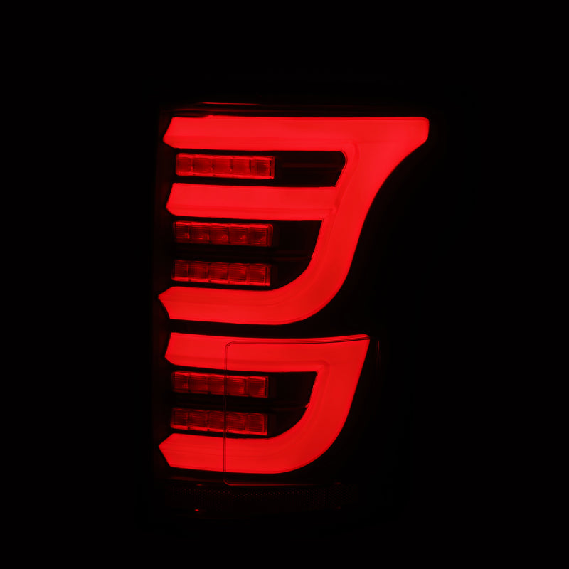AlphaRex Luxx-Series LED tail lights for 2015-2020 Ford F150 in alpha-black finish, featuring a sleek red illumination design.