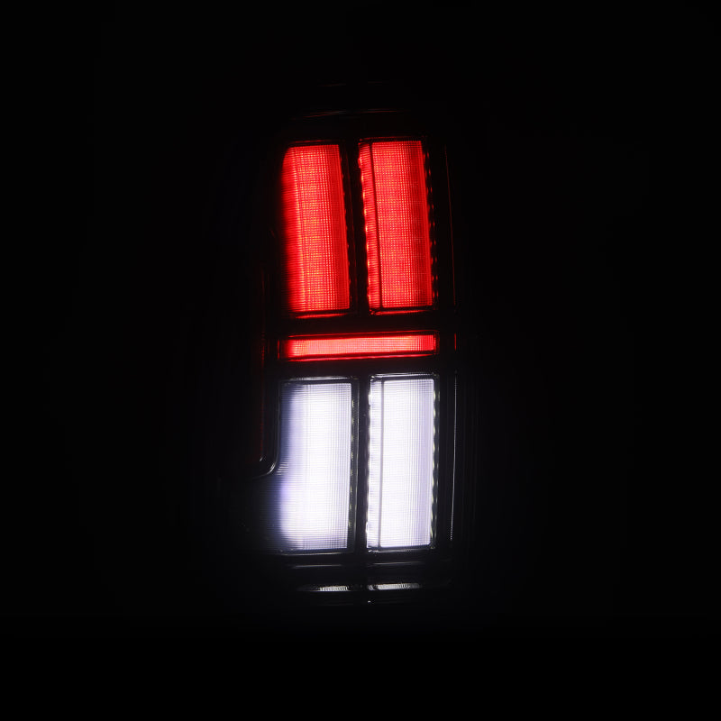 AlphaRex NOVA LED tail lights for 05-15 Toyota Tacoma in black, featuring a sleek design with red and white lighting.
