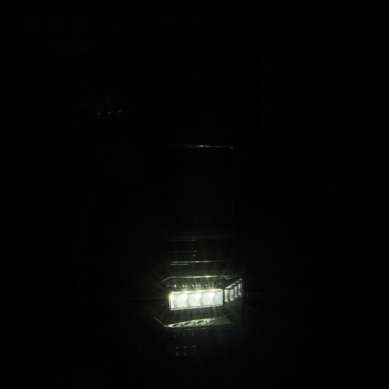 AlphaRex Luxx-Series LED tail lights for 19-21 Dodge Ram 1500 in Alpha-Black with sequential signals and active lighting.