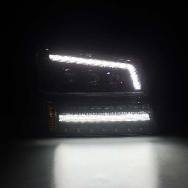 AlphaRex NOVA LED projector headlights for 03-06 Chevy Silverado and Avalanche, featuring a sleek black design and bright illumination.
