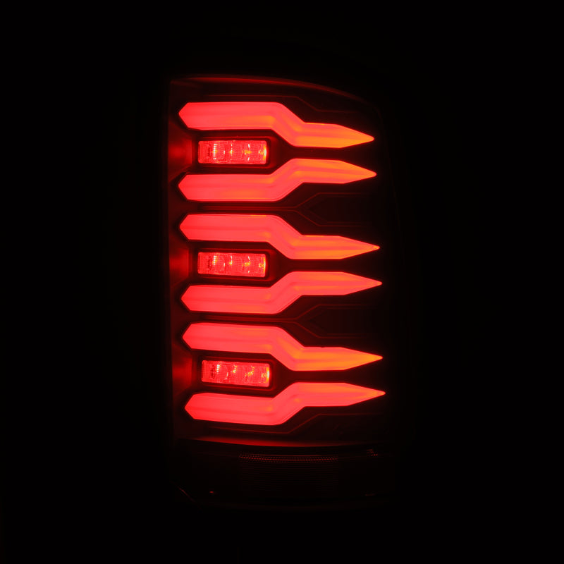AlphaRex Luxx-Series LED tail lights for 07-13 GMC Sierra 1500 and 07-14 2500/3500HD, featuring a sleek black design and bright red illumination.