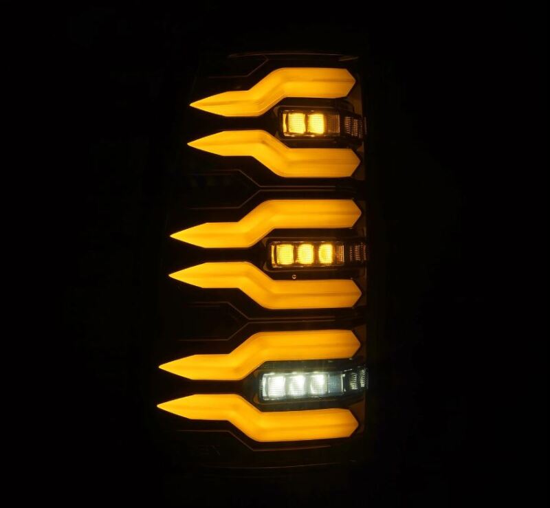 AlphaRex LUXX-Series LED tail lights for 99-06 Chevrolet Silverado and Sierra in alpha-black finish, featuring bright amber and white LEDs.