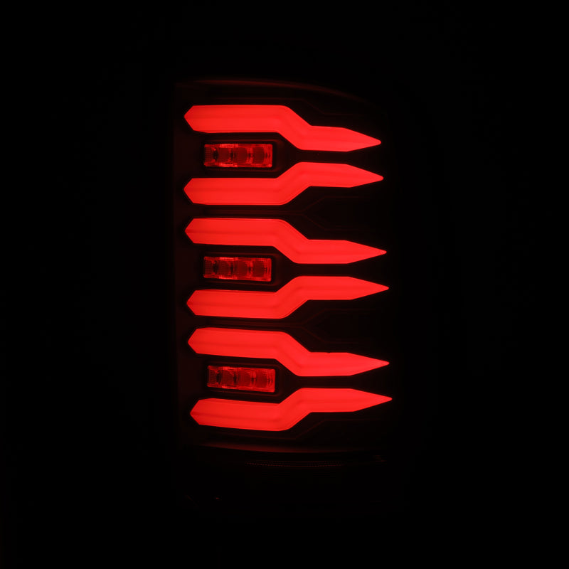 AlphaRex Luxx-Series LED tail lights for 07-13 GMC Sierra 1500 and 07-14 2500/3500HD in black with bright red illumination.