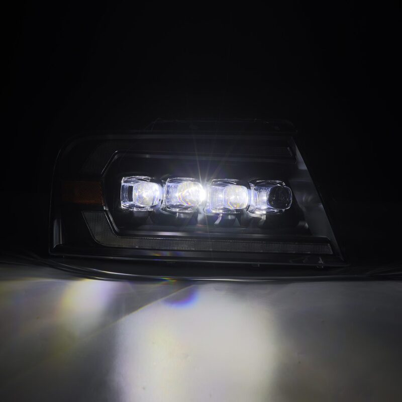 AlphaRex NOVA-Series LED projector headlights for 2004-2008 Ford F-150, featuring black housing and sequential signals.
