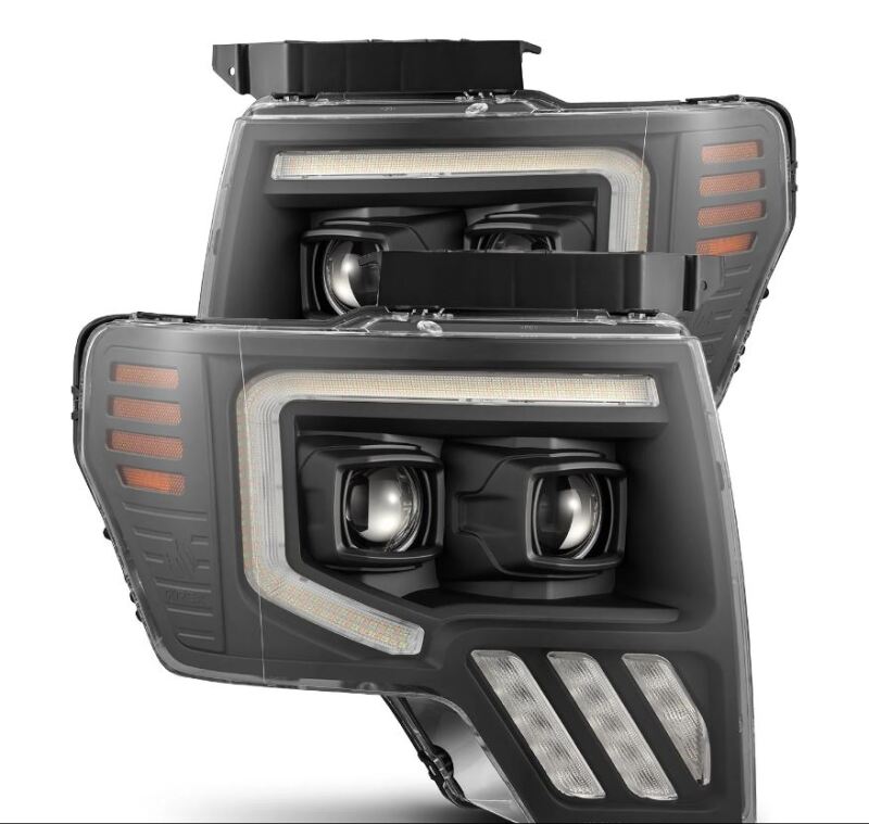 AlphaRex PRO-Series projector headlights for 09-14 Ford F-150 in black with sequential signal and active lighting features.