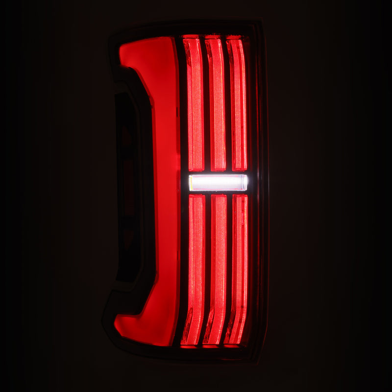 AlphaRex NOVA-Series LED prismatic tail lights for 24-25 Toyota Tacoma in black and red design, showcasing bright LED illumination.
