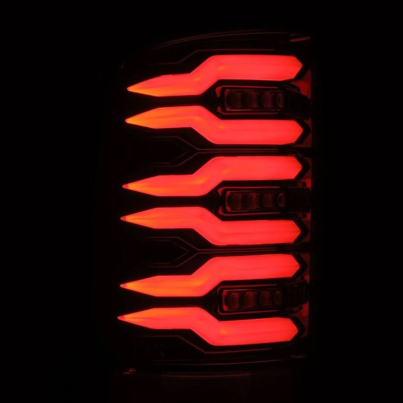 AlphaRex Luxx Series LED tail lights for 07-13 GMC Sierra models in alpha black with a striking red illumination design.