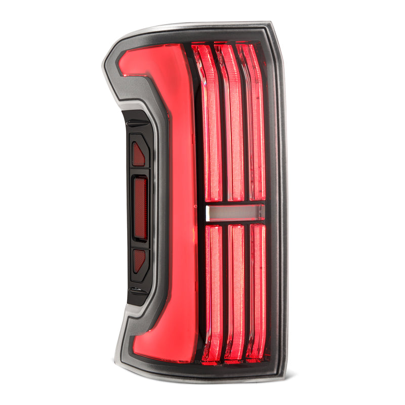 AlphaRex NOVA-Series LED prismatic tail light for 24-25 Toyota Tacoma in black, featuring a sleek design and bright illumination.