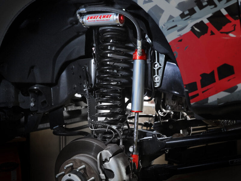 afe Sway-A-Way Smooth Body Shocks installed on a Ford F-250/F-350 17-24 4WD, showcasing suspension components and performance design.