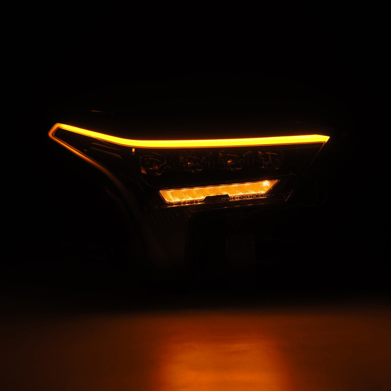 AlphaRex NOVA-Series headlights for 22-23 Toyota Tundra in black with white DRL, showcasing a sleek design and bright illumination.