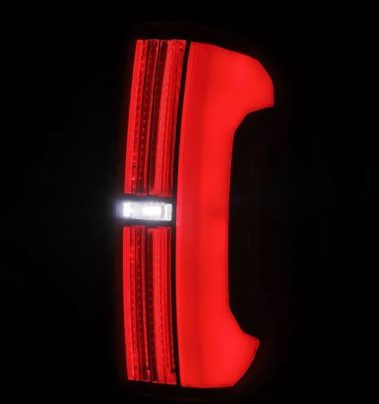 AlphaRex Nova-Series LED tail lights for 2014-2021 Toyota Tundra in black, featuring a sleek design and bright red illumination.