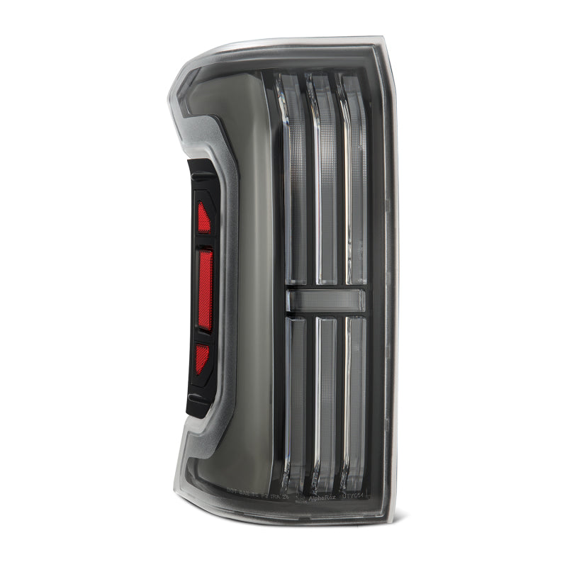 AlphaRex NOVA-Series LED prismatic tail light for 24-25 Toyota Tacoma in black, featuring a sleek design and enhanced visibility.