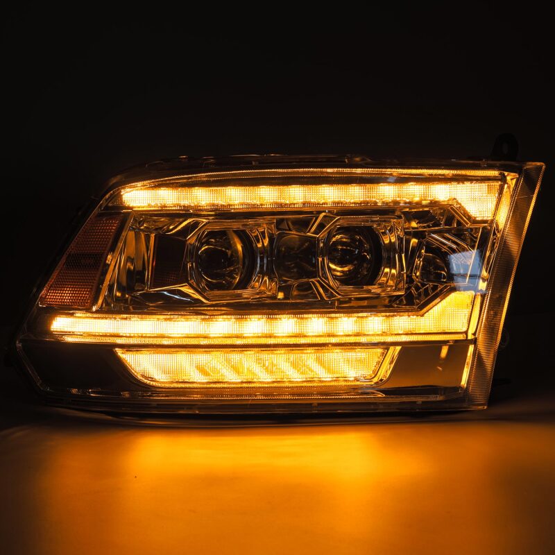 AlphaRex 09-18 Ram 1500 PRO-Series projector headlights with chrome finish, sequential signal, and DRL illumination.