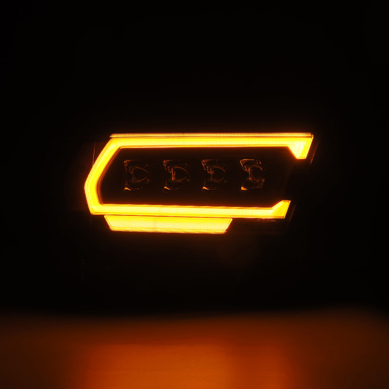 AlphaRex NOVA-Series projector headlights for 2019-2023 Dodge Ram 1500, featuring a sleek black design and bright amber accents.