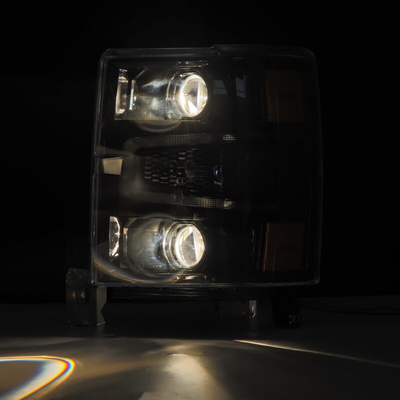 AlphaRex 14-15 Chevy 1500 PRO-Series projector headlights in alpha-black with sequential signal and DRL features.