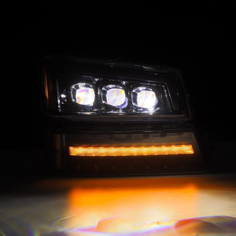 AlphaRex NOVA LED projector headlights for 03-06 Chevy Silverado and Avalanche, featuring a sleek black design and bright illumination.