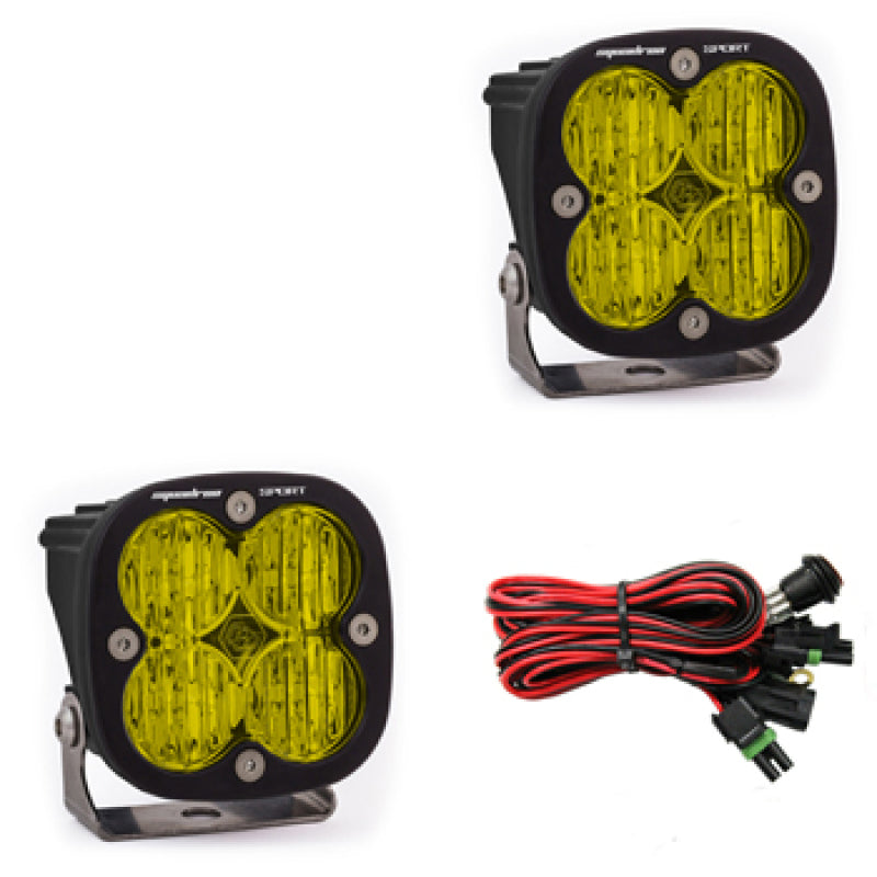 Baja Designs Squadron Sport Wide Cornering Pair LED light pods in amber, featuring four LED lights each and wiring harness.