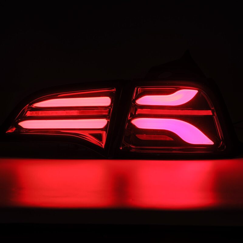 AlphaRex PRO-Series LED tail lights for 2017-2022 Tesla Model 3 in jet black with sequential signals.