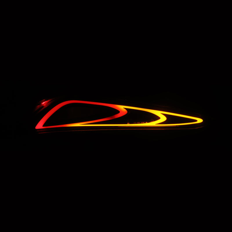 AlphaRex LUXX-Series FT-1 Style LED tail lights for 20-24 Toyota Supra in black, showcasing a sleek design with vibrant illumination.