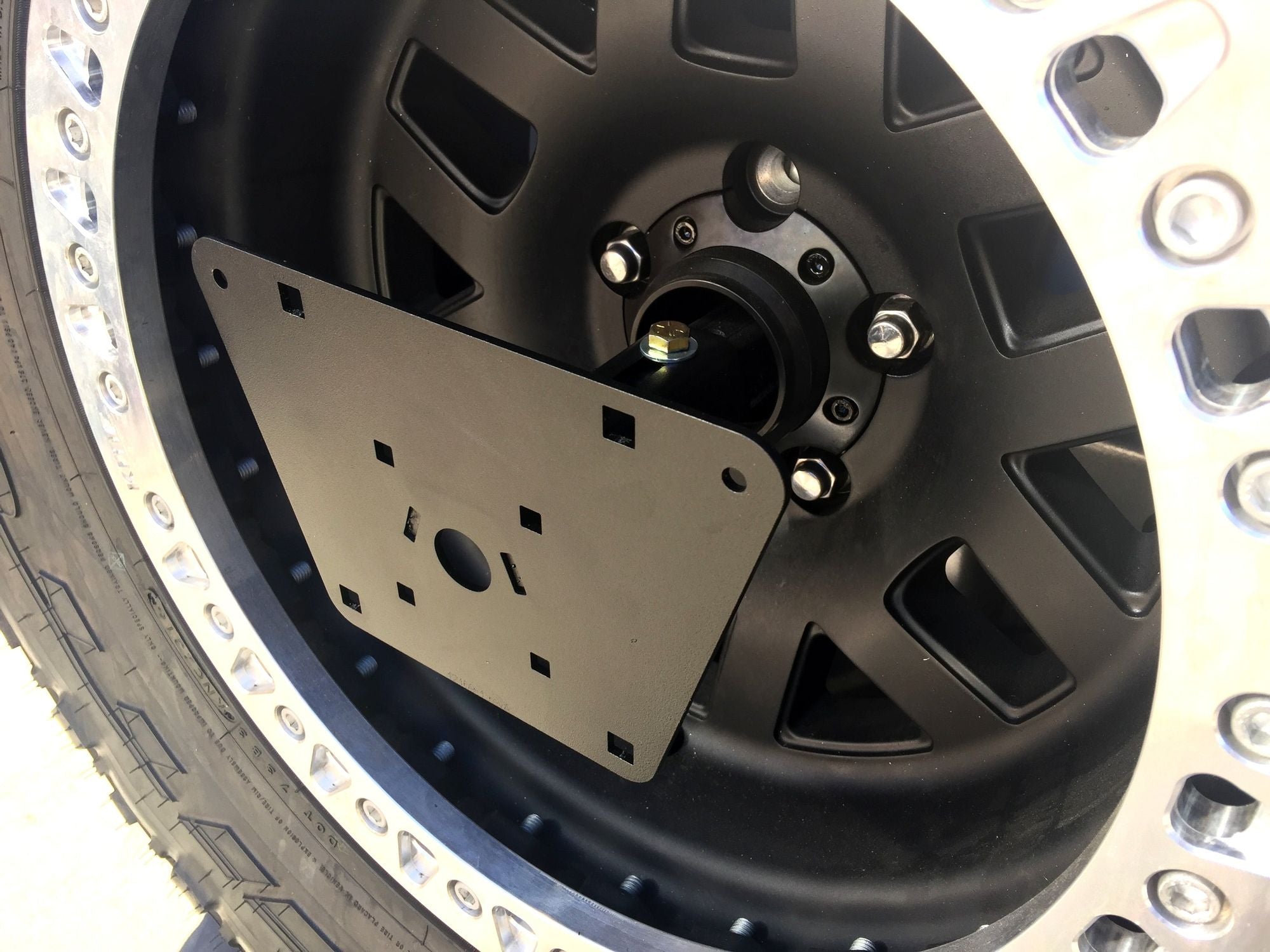 LICENSE PLATE RELOCATE/ROTOPAX CAN MOUNT