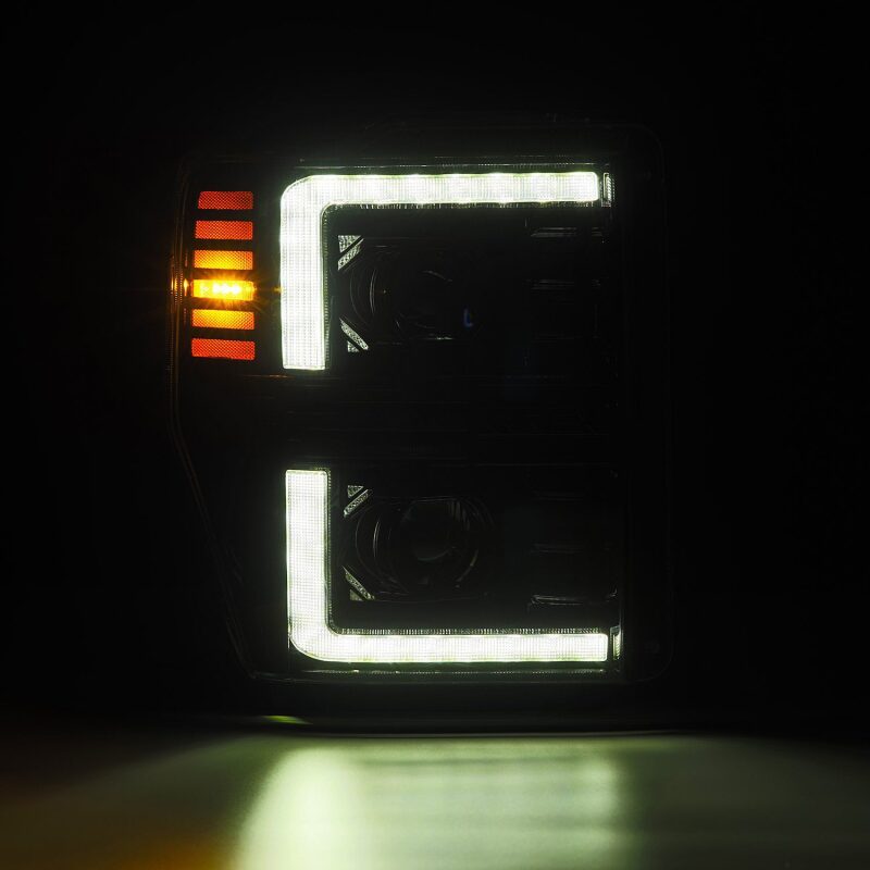 AlphaRex PRO-Series projector headlights for 08-10 Ford F250-550 in black with sequential signal and active light features.
