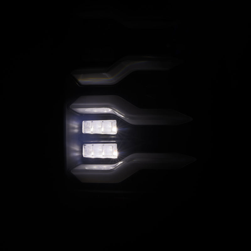 AlphaRex Luxx-Series LED tail lights for 09-18 Dodge Ram in alpha-black with activation light and sequential signal.