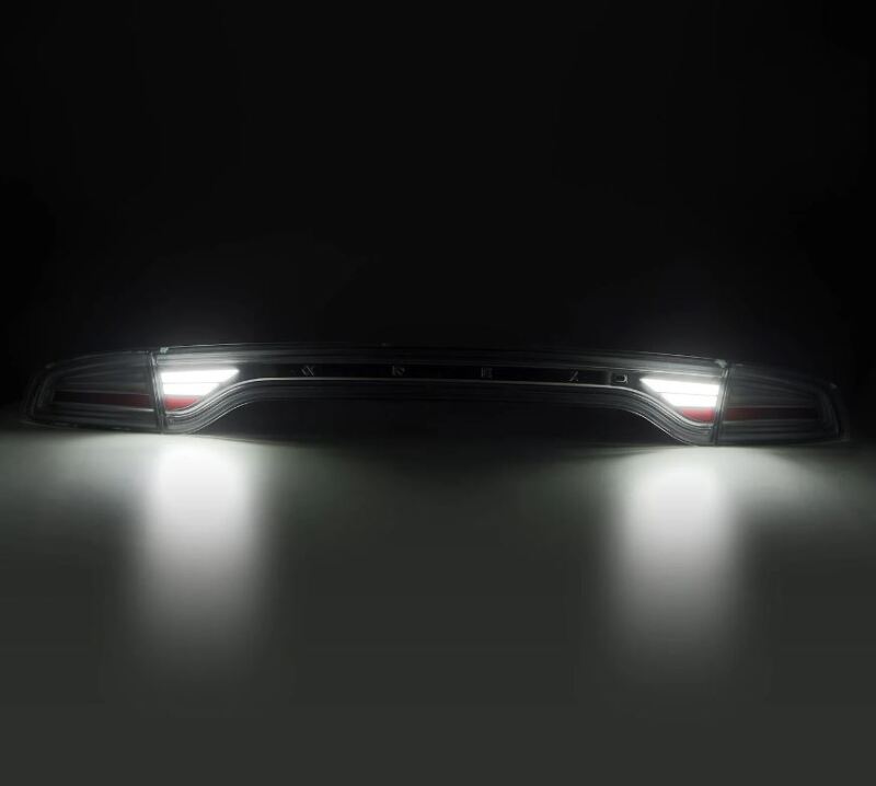 AlphaRex 15-23 Dodge Charger Nova-Series LED tail lights in Alpha-Black, showcasing a sleek design with bright illumination.