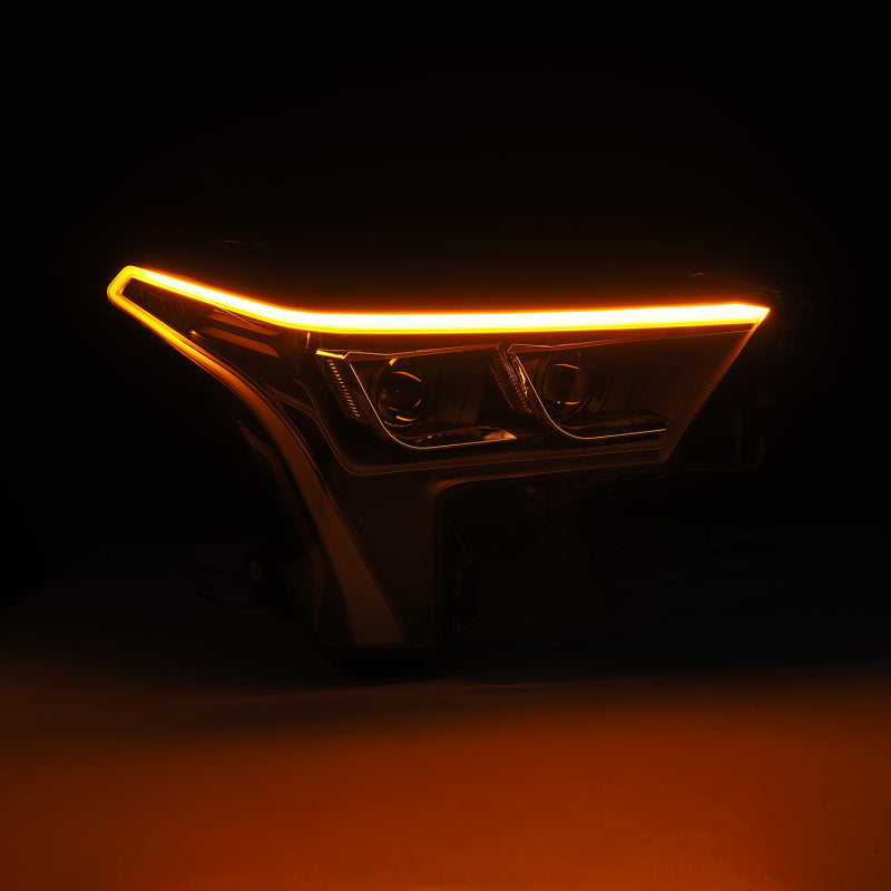 AlphaRex LUXX-Series black headlights for 22-23 Toyota Tundra with white daytime running lights. Enhanced visibility and style.