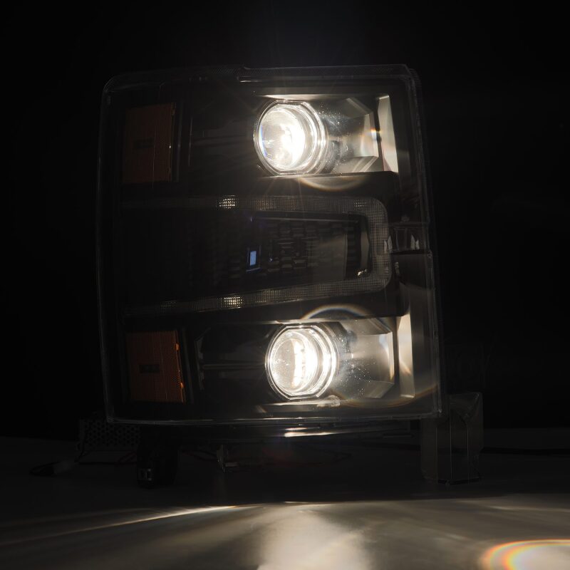 AlphaRex 14-15 Chevy 1500 PRO-Series projector headlights in black with sequential signal and daytime running lights.